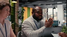 Hiring process meeting between confident candidate and a professional team from the HR department, reviewing documents and CV qualifications in a formal job posting for business. Camera A. - Powered by Shutterstock - Get 15% off with code: PIKWIZARD15