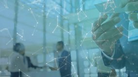 Business professionals shaking hands, sparking phone icon, network graphics during card exchange. Corporate, networking, technology, partnership, communication, modern, professional - Powered by Shutterstock - Get 15% off with code: PIKWIZARD15