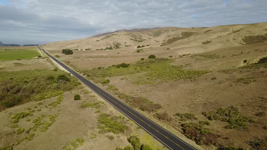 HD Drone Footage of Highway 1 surrounded by a prairie in Big Sur, California