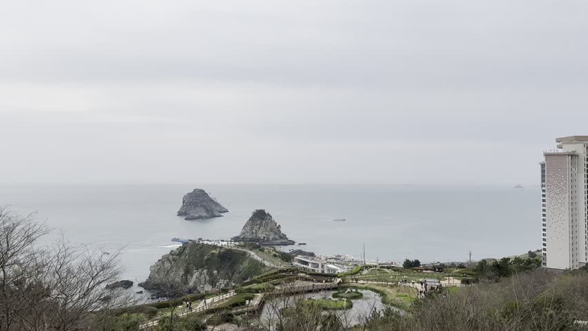 The sea view of Oryukdo Island in Busan, South Korea and the high-rise buildings next to it