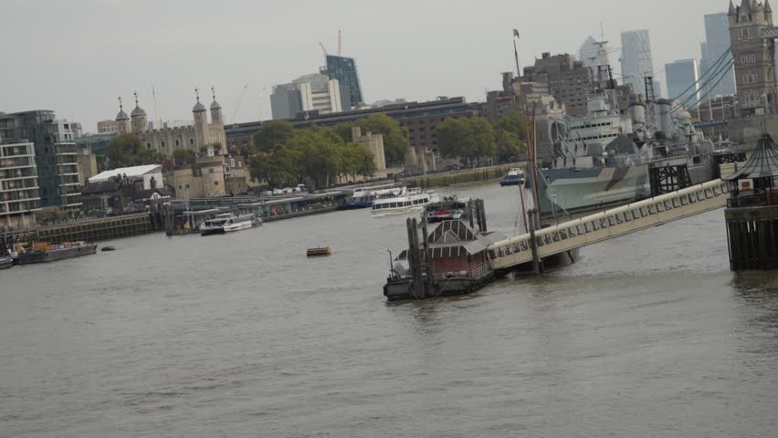 River Thames View from London Bridge with Tower Bridge, Boats, and City Landmarks in London, UK. Video taken on 2 October 2025 in London. UK