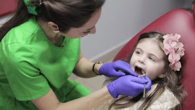 A Pediatric Dental Checkup A Caring Dentist Providing Comfort and Support to a Young Patient - Powered by Shutterstock - Get 15% off with code: PIKWIZARD15