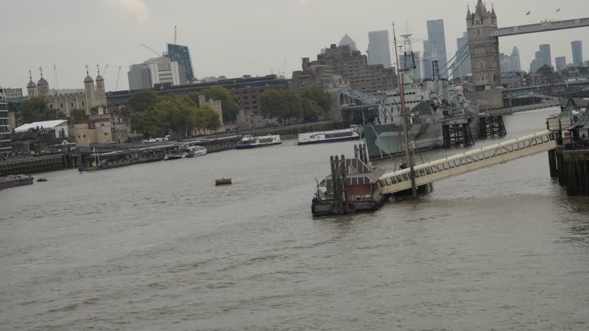 River Thames View from London Bridge with Tower Bridge, Boats, and City Landmarks in London, UK. Video taken on 2 October 2025 in London. UK