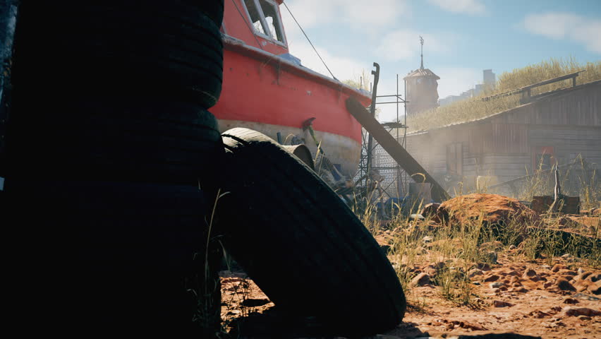Abandoned red boat stranded on rocky desert ground, surrounded by barrels, crates, and debris, with a human skeleton sitting in a chair beneath its hull.
