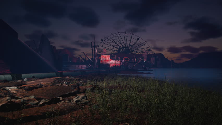 Abandoned Ferris wheel and rusted industrial ruins by a lake in the dark, with tall grass in the foreground and hazy mountains in the distance.
