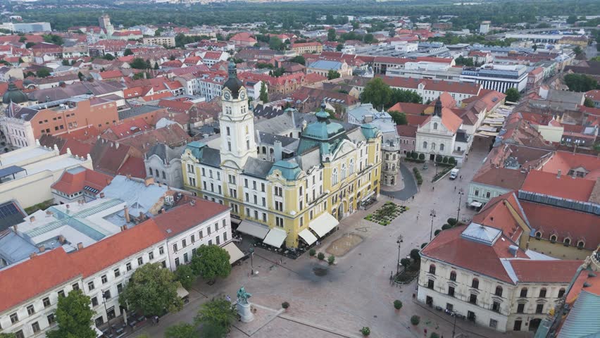 Pécs Town Hall tower with Széchenyi Square below, showcasing the heart of the city