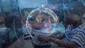 Boy typing at computer lab desk triggers rotating transparent globe visualizing network connections. Technology, education, collaboration, innovation, learning, digital, connectivity - Powered by Shutterstock - Get 15% off with code: PIKWIZARD15