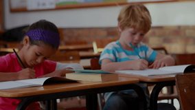 Students writing notebooks at desks with education doodle icons fading in while camera panning. Classroom, education, learning, childhood, stationery, doodles, teamwork - Powered by Shutterstock - Get 15% off with code: PIKWIZARD15