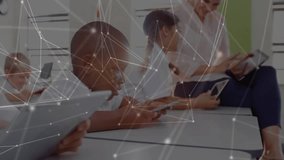 Teacher handing tablets to students, network overlay guiding lesson, camera zooming on smiling boy. Education, technology, collaboration, e-learning, youth, classroom, digital - Powered by Shutterstock - Get 15% off with code: PIKWIZARD15