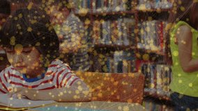 Student studying at library table for education, turning pages and creating golden particle overlay. Children, education, study, reading, library, learning, knowledge - Powered by Shutterstock - Get 15% off with code: PIKWIZARD15