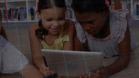 Students lying in library tapping tablets while grid and line graphs appearing for group learning. Collaboration, education, technology, youth, engagement, learning, innovation - Powered by Shutterstock - Get 15% off with code: PIKWIZARD15