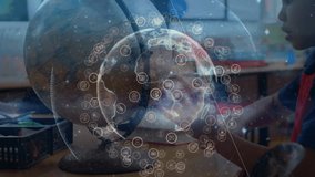 Student boy leaning toward globe in classroom for viewing data, upon start overlay fading rotating. Educational, technology, digital, network, data, learning, innovation - Powered by Shutterstock - Get 15% off with code: PIKWIZARD15