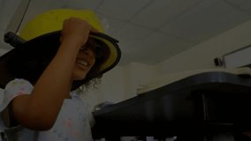 Girl picking up helmet triggers network icons showing teamwork, sketching with teacher in tech lab. Education, collaboration, mentorship, innovation, digital connectivity, stem, creativity - Powered by Shutterstock - Get 15% off with code: PIKWIZARD15