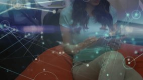 woman tapping tablet and activating network overlay for business data while team collaborating. Collaboration, teamwork, innovation, connectivity, modern, workspace, technology - Powered by Shutterstock - Get 15% off with code: PIKWIZARD15