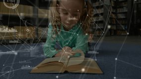 Girl lying on library rug pointing line and initiating pulsing learning data overlay while reading. Children, education, digital, research, innovation, study, literacy - Powered by Shutterstock - Get 15% off with code: PIKWIZARD15