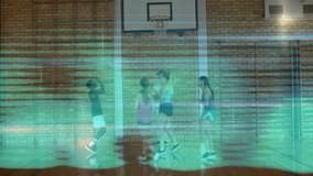 Youth lifting basketball starting jump shot in sports drill teammates tracking ball arc toward hoop. Athletes, teamwork, training, fitness, dynamic, sport, youthful - Powered by Shutterstock - Get 15% off with code: PIKWIZARD15