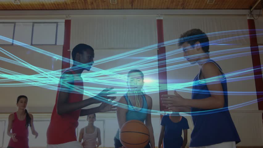 Referee tossing basketball starting play with digital blue light trails guiding players