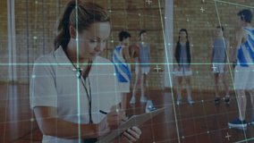 Coach timing basketball dribbling and noting times on clipboard stopwatch in gym signalling player. Athletic, teamwork, training, performance, discipline, fitness, motivation - Powered by Shutterstock - Get 15% off with code: PIKWIZARD15