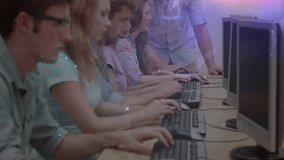 After observing learners typing instructor pointing at monitor and guiding computer lab students. Collaboration, mentorship, education, technology, classroom, teamwork, digital learning - Powered by Shutterstock - Get 15% off with code: PIKWIZARD15