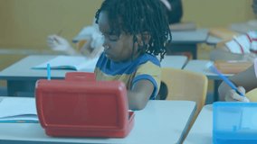 Boy writing beside red tablet causing floating data panels while girl writing lines in classroom. Education, technology, innovation, classroom, learning, digital, teamwork - Powered by Shutterstock - Get 15% off with code: PIKWIZARD15