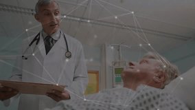 Senior doctor reading patient notes and guiding nurse writing with red pen beside hospital IV pump. Medical team, healthcare, clinical, collaboration, professionalism, patient care, diagnosis - Powered by Shutterstock - Get 15% off with code: PIKWIZARD15