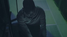 Male technician typing and monitoring data center encryption, glitchy overlay animating circuits. Cybersecurity, technology, digital, network, innovation, professional, futuristic - Powered by Shutterstock - Get 15% off with code: PIKWIZARD15