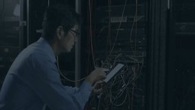 IT technician crouching at server rack, tapping tablet and encrypting data with code overlay. Technology, cybersecurity, networking, data, digital, industrial, modern - Powered by Shutterstock - Get 15% off with code: PIKWIZARD15