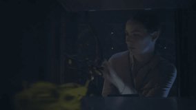 Woman tapping interface and swiping, animating encryption circuits while reviewing tablet data. Cybersecurity, holographic, futuristic, technology, data, electronics, innovation - Powered by Shutterstock - Get 15% off with code: PIKWIZARD15