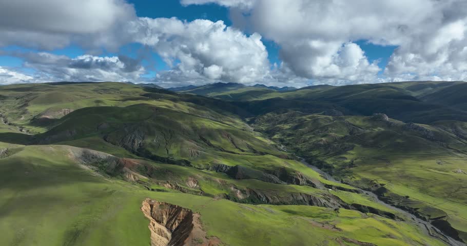 Beautiful green grassland and cloudy sky in Litang county, China