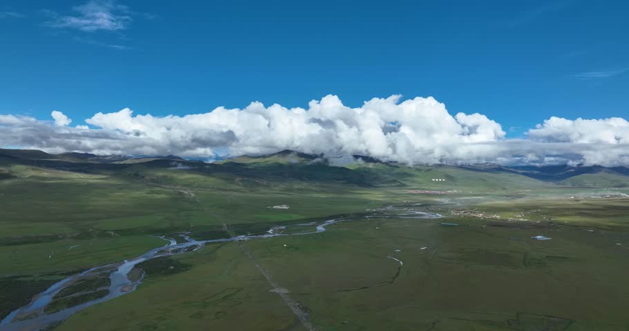 Beautiful green grassland and cloudy sky in Litang county, China
