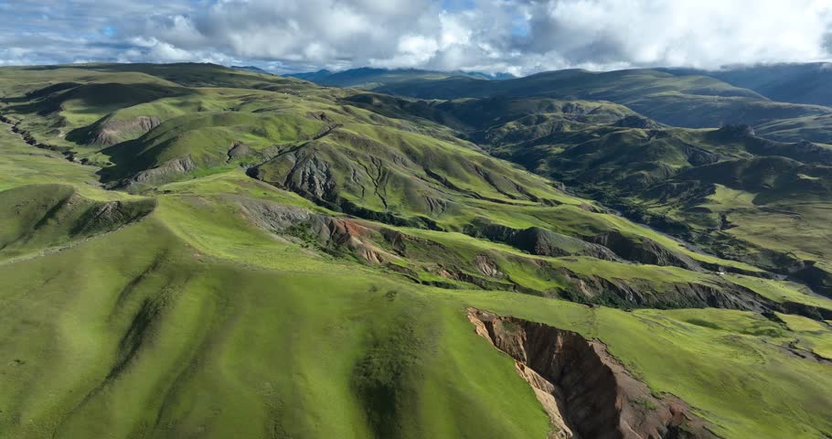 Beautiful green grassland and cloudy sky in Litang county, China