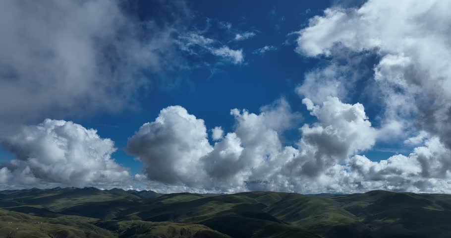 Beautiful green grassland and cloudy sky in Litang county, China