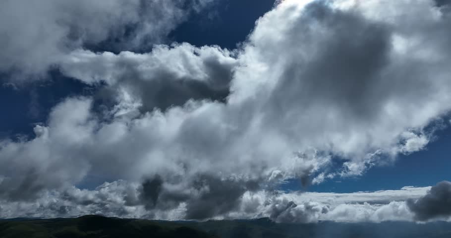 Beautiful green grassland and cloudy sky in Litang county, China