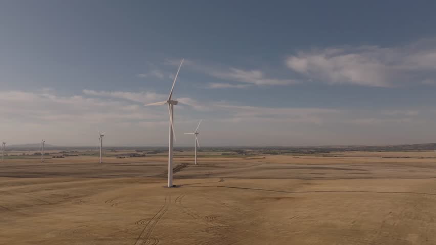 Drone shot of windmills in Montana at sunset