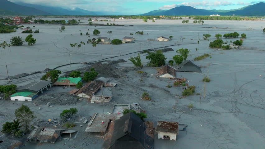 Aerial view of mud-covered houses after flooding
