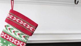 Hanging a dog's Christmas stocking on the mantel - Powered by Shutterstock - Get 15% off with code: PIKWIZARD15