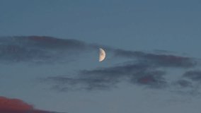 Half Moon and Clouds Time-Lapse. Moon Moving Across Twilight Sky to Nigh - Powered by Shutterstock - Get 15% off with code: PIKWIZARD15