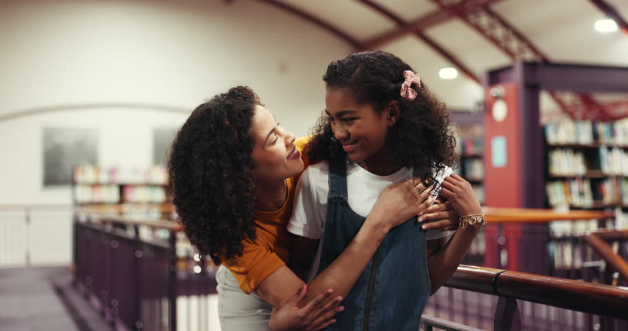 Face, mother and child with hug in library for bonding together, connection and skill development. Smile, parent and daughter with embrace in bookshop for knowledge, learning support or storytelling.