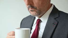Closeup of businessman holding white coffee cup near office window, morning routine and workplace lifestyle. 4K with selective focus. - Powered by Shutterstock - Get 15% off with code: PIKWIZARD15