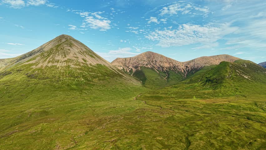 Stunning aerial view of Isle of Skye majestic mountains and lush green valleys