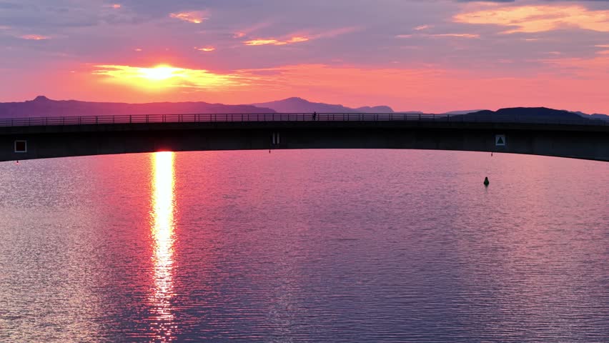 Breathtaking aerial views of sunset over the serene waters of Isle of Skye in Scotland