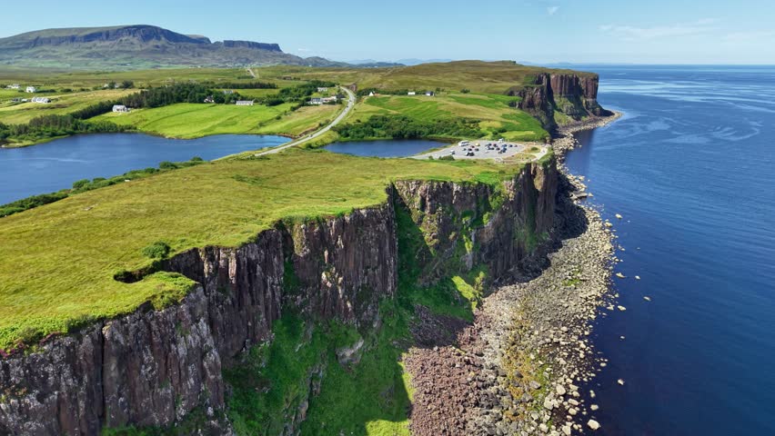 Explore the breathtaking cliffs and lush landscapes of the Isle of Skye in Scotland from above