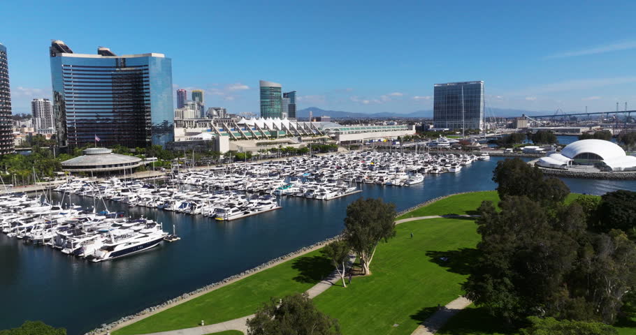 Docked Boats At The Marina In San Diego Bay Skyline In California, United States. Aerial Drone Shot