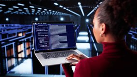 Cloud Computer Engineer Coding In Server Room In Data Center. Configuring AI Technology - Powered by Shutterstock - Get 15% off with code: PIKWIZARD15