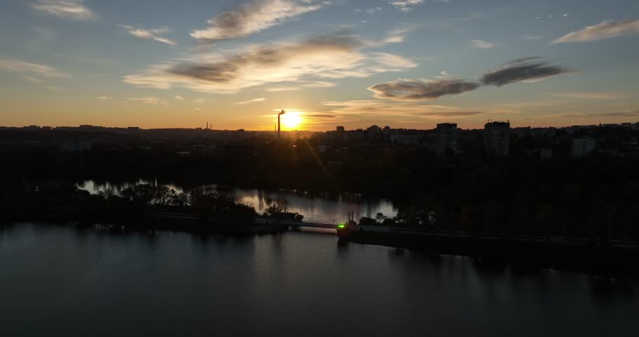 Sunset over city skyline and lake in Chișinău, Moldova