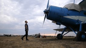 Pilot inspecting aircraft propeller, demonstrating meticulous attention to detail, as he prepares for flight, showcasing the dedication and craftsmanship involved in aviation maintenance and safety - Powered by Shutterstock - Get 15% off with code: PIKWIZARD15