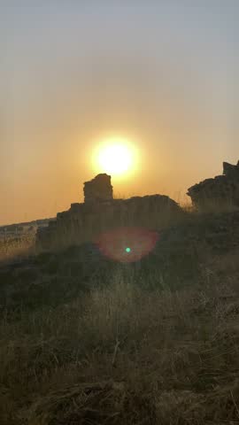 Wonderful sunset casting warm golden and orange hues over the charming village of Salvatierra de Tormes, Spain