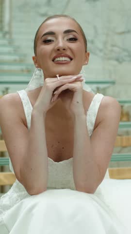 Luxury fashion bride in a white dress.Young woman with beautiful hairstyle and makeup.