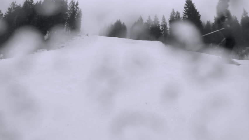 Motion camera view of skier is riding in the mountains. pov