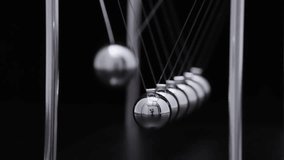 Newton's cradle pendulum with chrome steel balls demonstrating physics principles of momentum transfer and energy conservation in motion - Powered by Shutterstock - Get 15% off with code: PIKWIZARD15